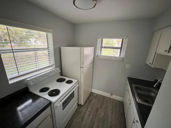 a storage and utility room with a window