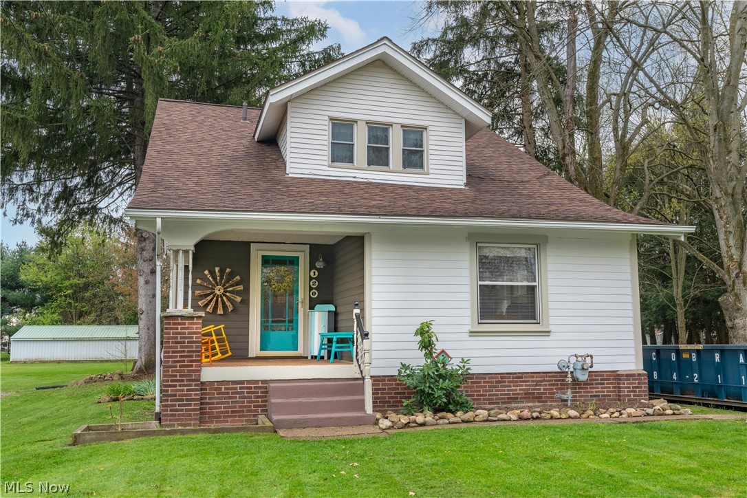120 34th Street Southwest Canton, OH 44706 - Photo 1 of 30 View of front facade with a porch and a front yard