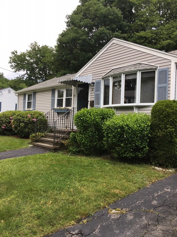 6 Rindone Street Holbrook, MA 02343 - Photo 1 of 18 a front view of a house with a garden