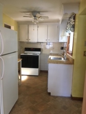 6 Rindone Street Holbrook, MA 02343 - Photo 3 of 18 a kitchen with granite countertop a sink and a stove with a refrigerator