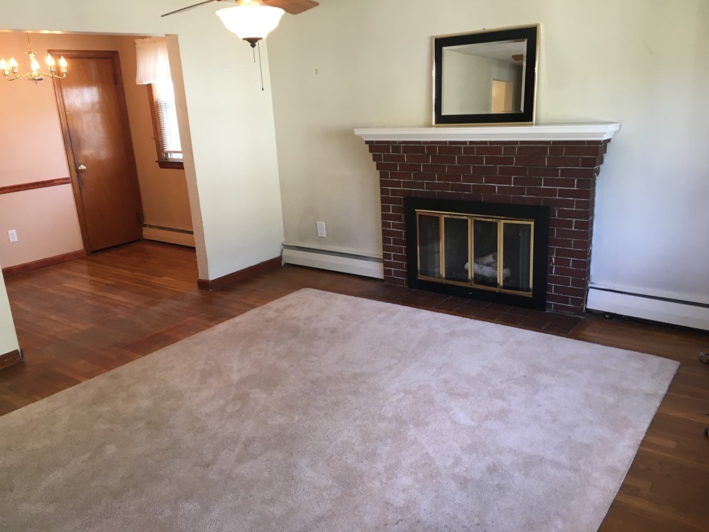 6 Rindone Street Holbrook, MA 02343 - Photo 9 of 18 a view of empty room with a fireplace