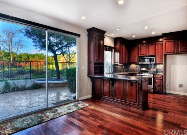 3 Acorn Ridge Rancho Santa Margarita, CA 92688 - Photo 1 of 1 The remodeled kitchen has custom cabinets with pull out drawers, granite counters and stainless steel appliances.