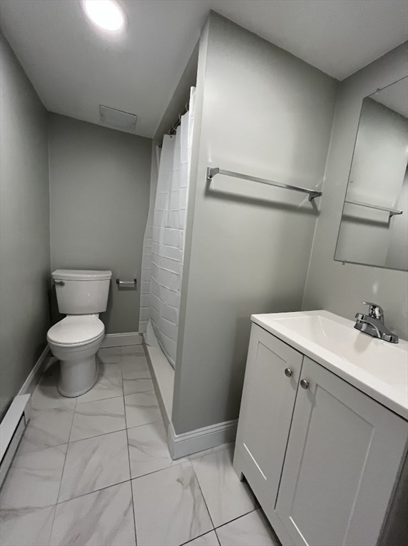 506 Beacon Street, Unit C Boston, MA 02215 - Photo 4 of 4 a bathroom with a sink and toilet