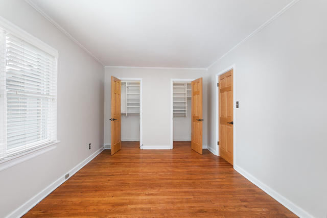 S477 Winfield Road Winfield, IL 60190 - Photo 12 of 29 a view of empty room with wooden floor and fan