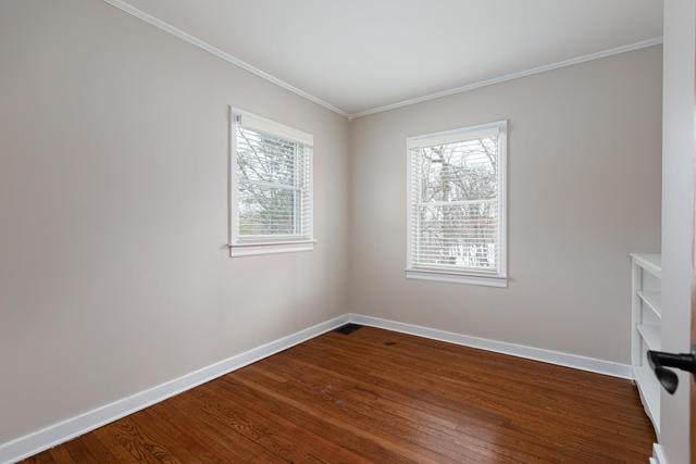 S477 Winfield Road Winfield, IL 60190 - Photo 13 of 29 an empty room with wooden floor and windows