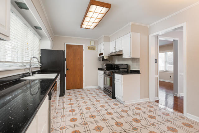 S477 Winfield Road Winfield, IL 60190 - Photo 21 of 29 a kitchen with stainless steel appliances a refrigerator sink stove and cabinets