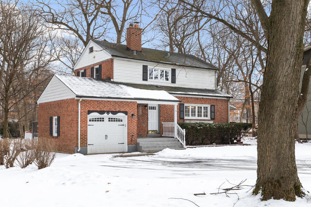 S477 Winfield Road Winfield, IL 60190 - Photo 25 of 29 a front view of a house with a yard and garage