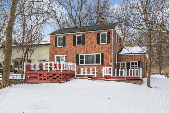 S477 Winfield Road Winfield, IL 60190 - Photo 27 of 29 a view of a house with a yard covered in snow