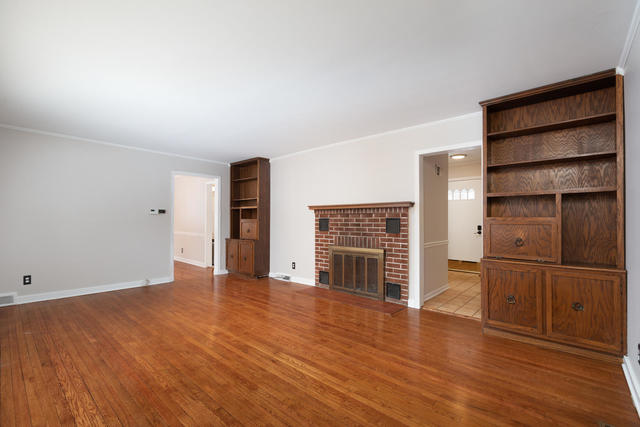 S477 Winfield Road Winfield, IL 60190 - Photo 4 of 29 an empty room with wooden floor closet and windows
