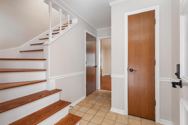 S477 Winfield Road Winfield, IL 60190 - Photo 9 of 29 a view of entryway and hall with wooden floor