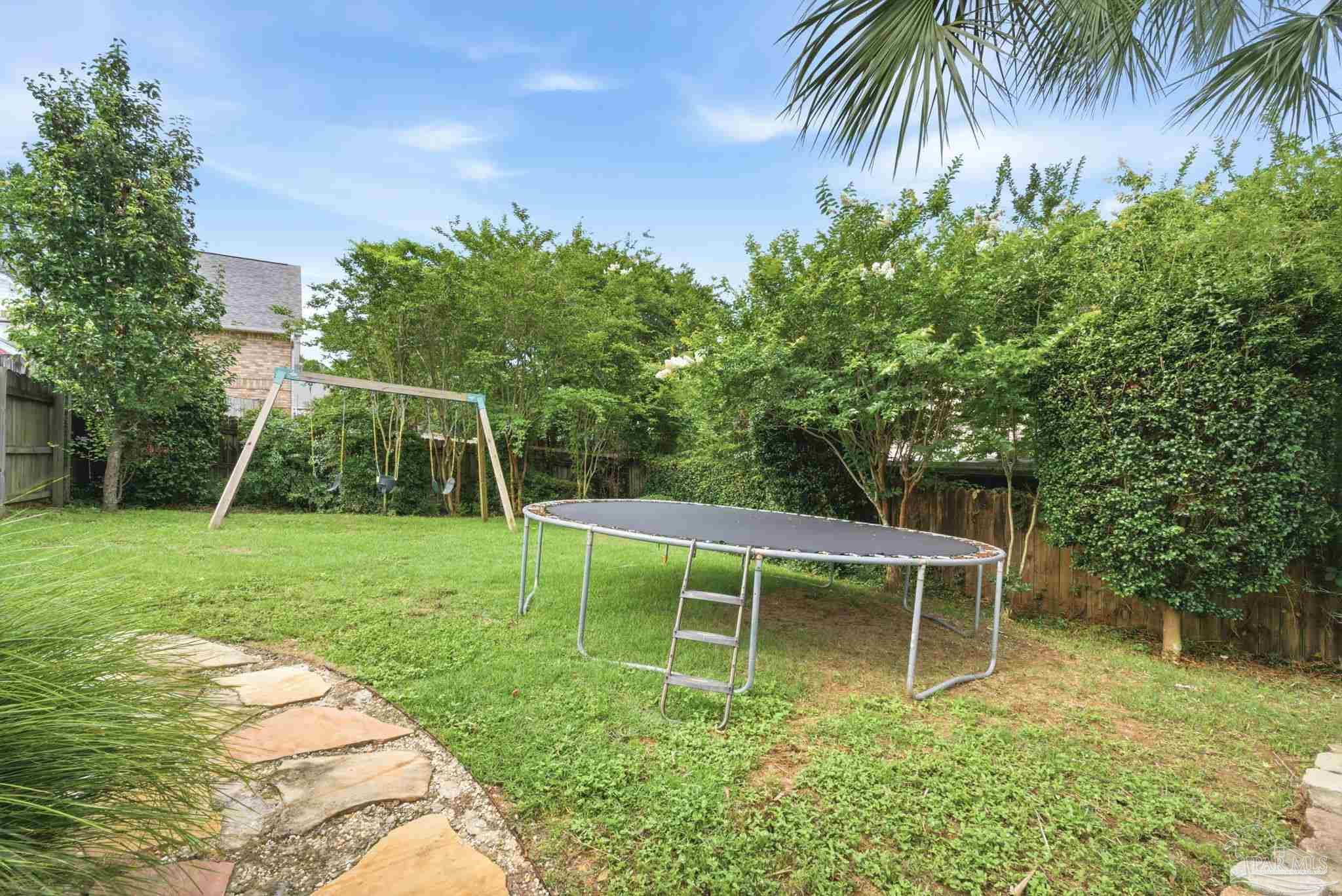 5931 Otter Point Road Pensacola, FL 32504 - Photo 45 of 67 a view of a chair and table in the garden