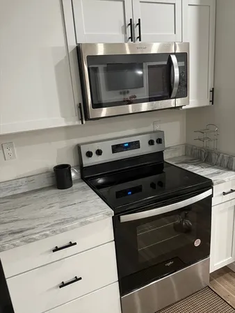 a kitchen with a stove and a microwave