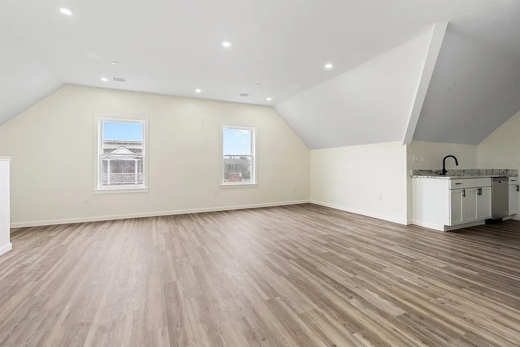 20 Graham Street, Unit 4 Gardner, MA 01440 - Photo 18 of 23 wooden floor in an empty room with a window