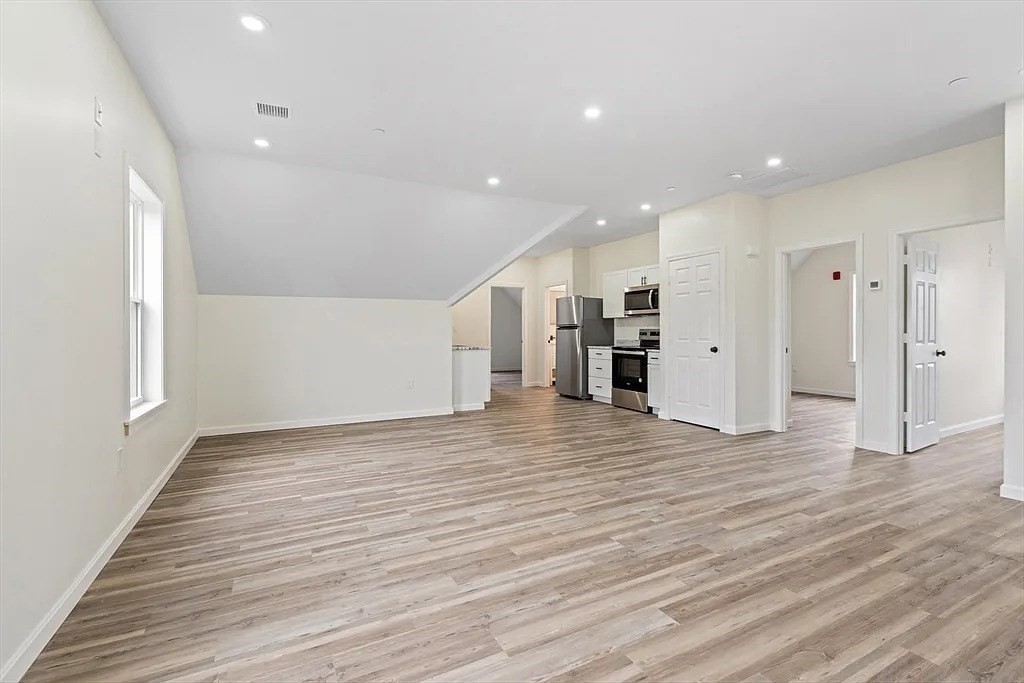 20 Graham Street, Unit 4 Gardner, MA 01440 - Photo 20 of 23 a view of an empty room with wooden floor