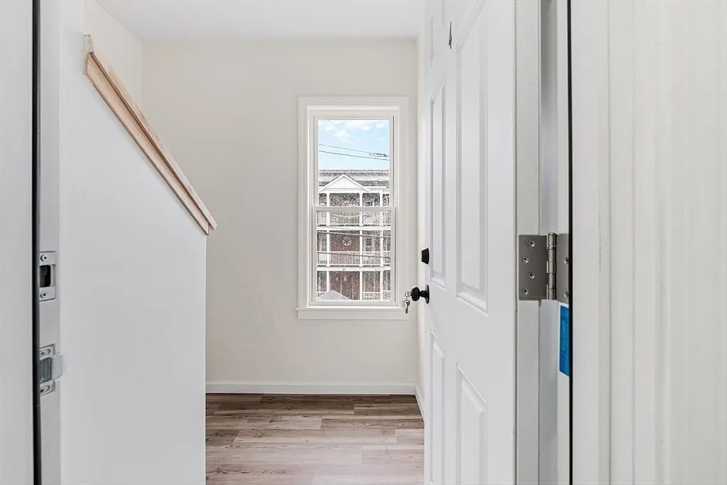 20 Graham Street, Unit 4 Gardner, MA 01440 - Photo 2 of 23 a view of a livingroom with wooden floor and windows