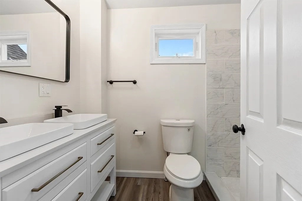 20 Graham Street, Unit 4 Gardner, MA 01440 - Photo 5 of 23 a bathroom with a granite countertop toilet and a sink