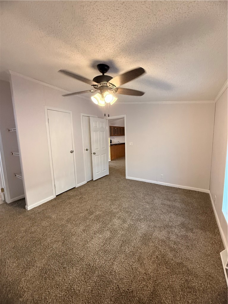307 West 7th Street St. Elmo, IL 62458 - Photo 16 of 17 a view of an empty room with a ceiling fan