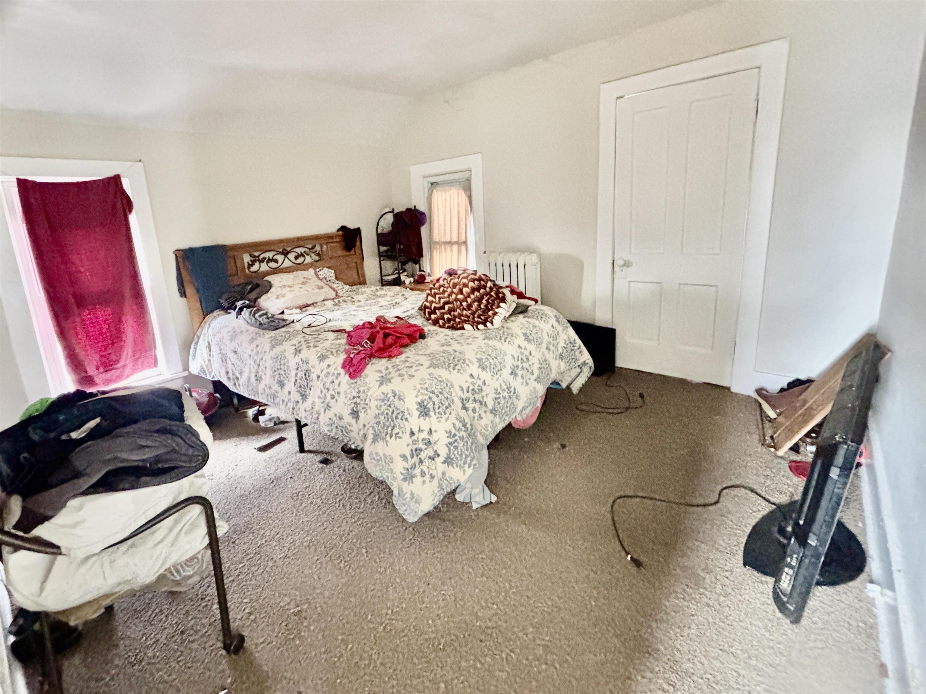 1016 South Main Street Belvidere, IL 61008 - Photo 15 of 17 a bedroom with a bed and window