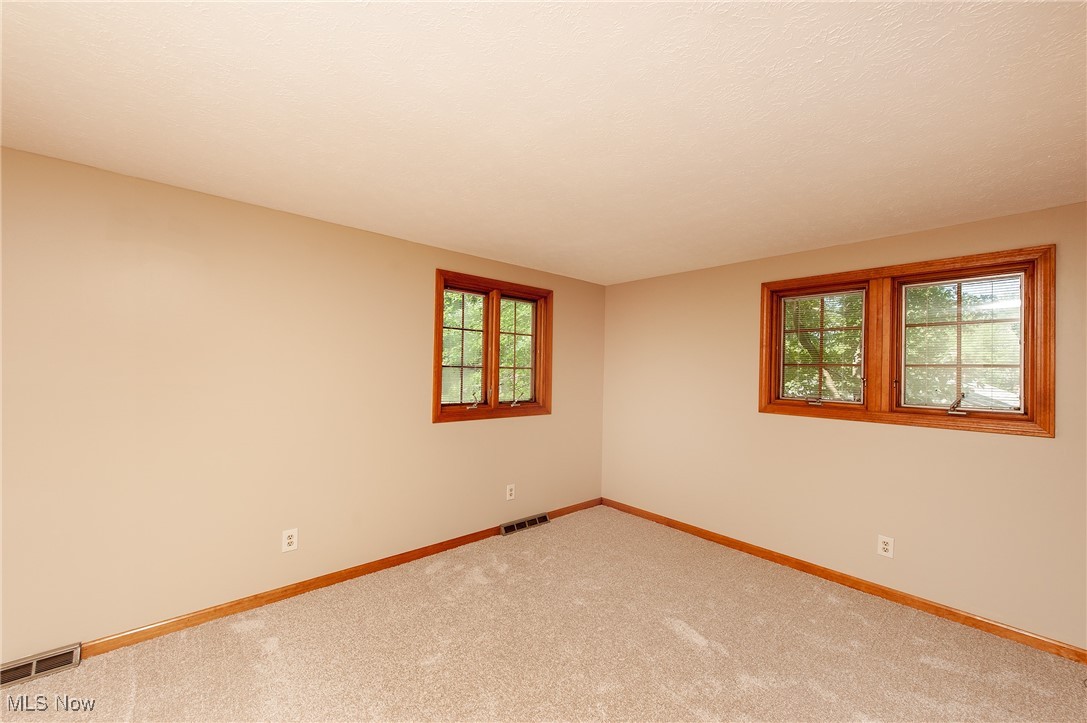 27680 Dunford Road Westlake, OH 44145 - Photo 15 of 31 Carpeted spare room with baseboards