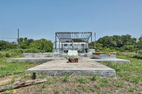 a view of the patio with a yard