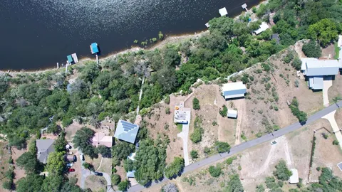 an aerial view of a house with outdoor space