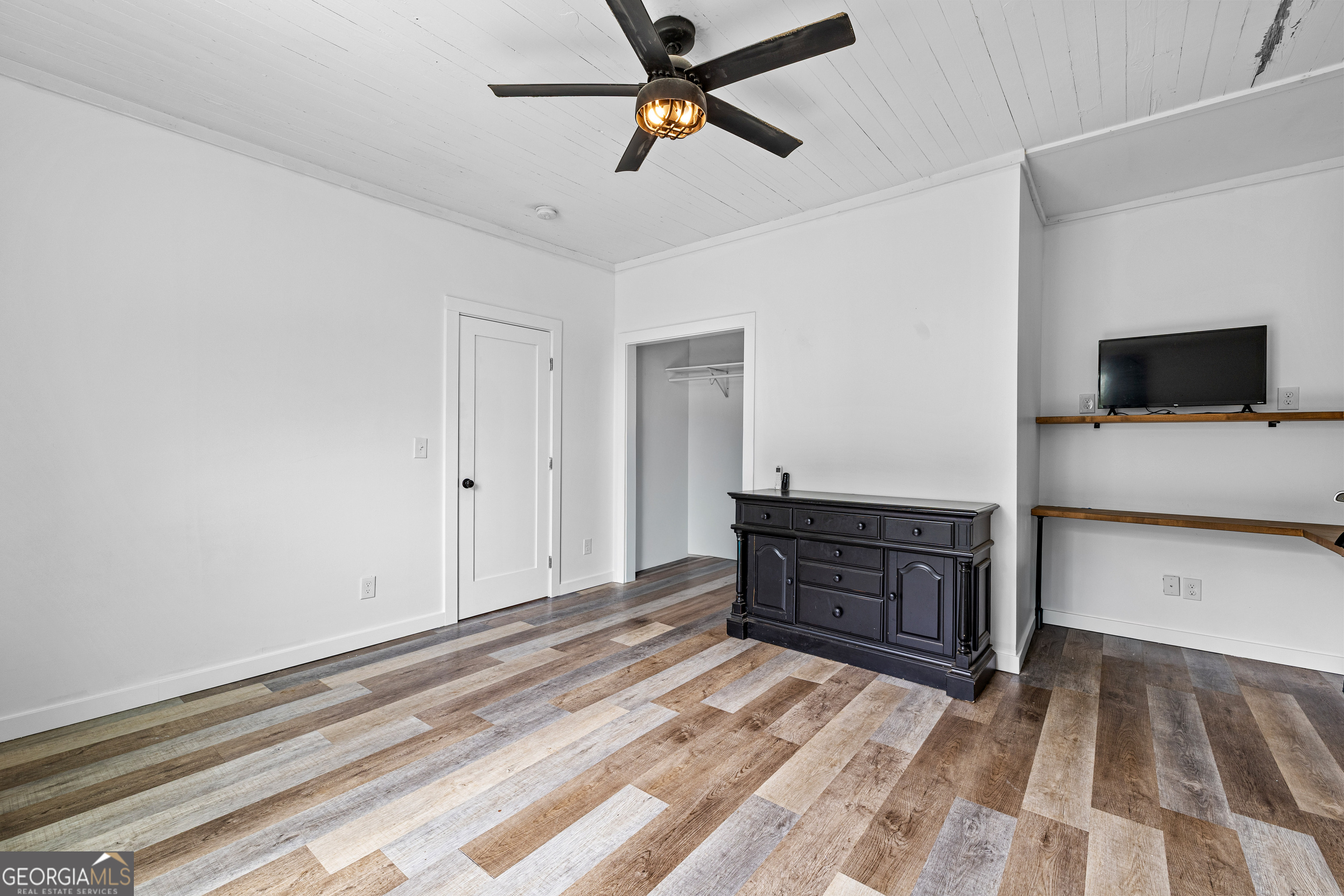 1329 Standing Rock Road Senoia, GA 30276 - Photo 39 of 77 a bedroom with a bed and a dresser