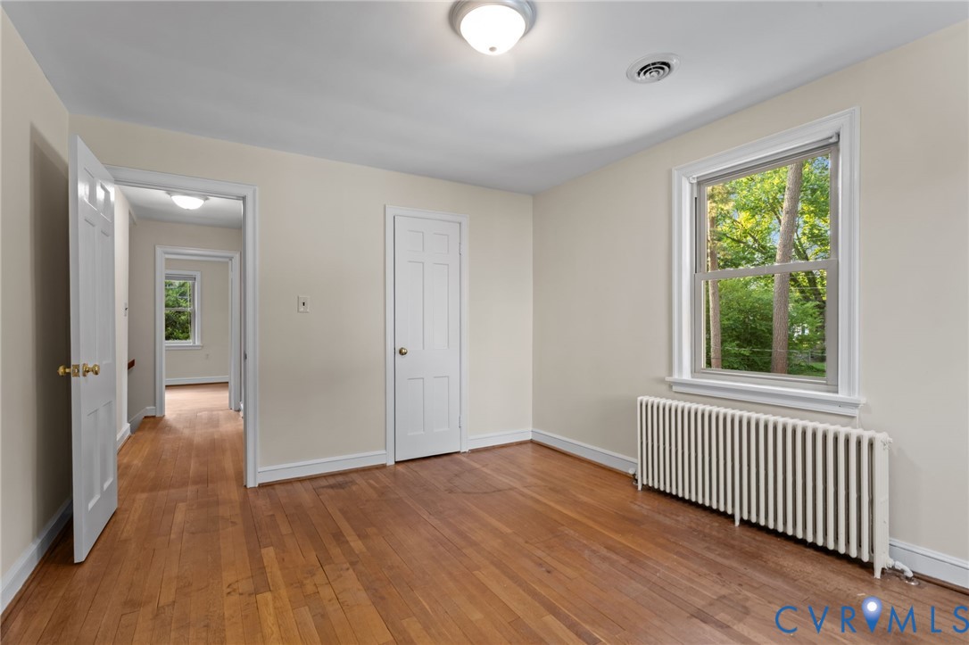 4804 Morrison Road Richmond, VA 23230 - Photo 30 of 48 a view of an empty room with wooden floor and a window