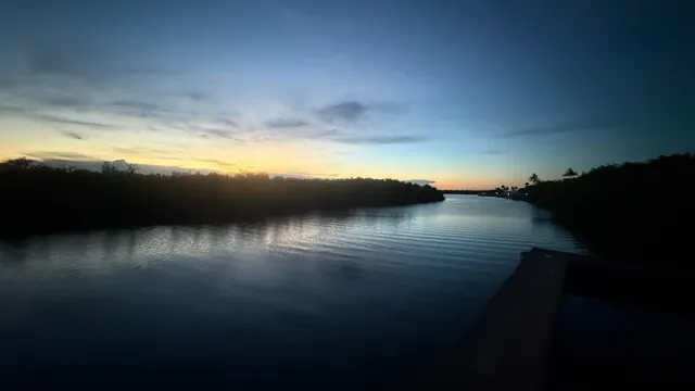 a view of water heater room with wooden floor