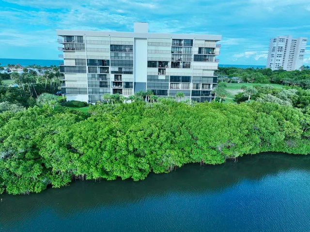 a view of a lake with building in front of house