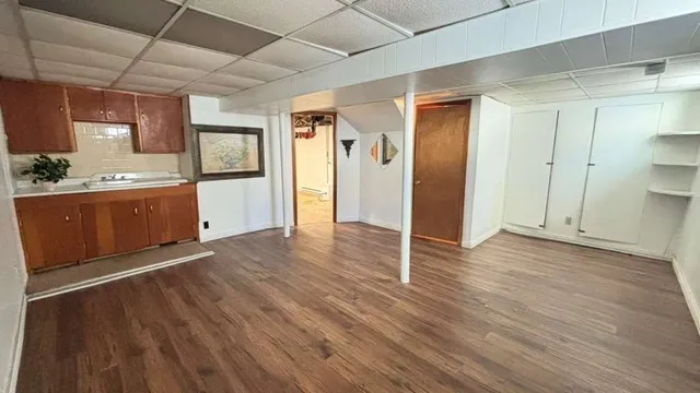 a spacious bathroom with a double vanity sink and a mirror