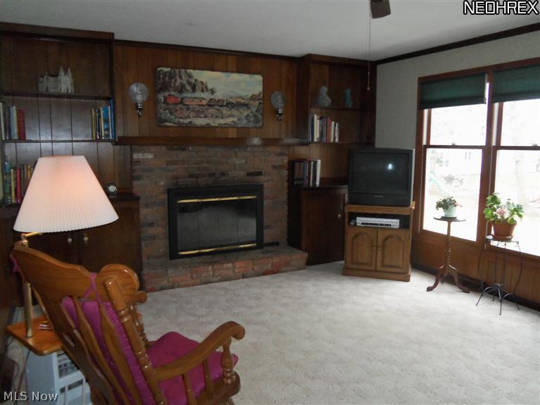 8257 Johnnycake Ridge Road Mentor, OH 44060 - Photo 3 of 25 Family room with fireplace