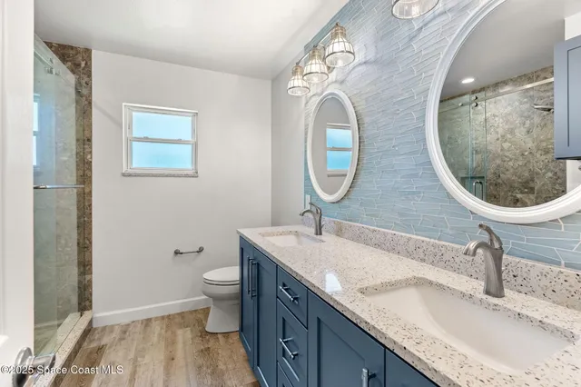 a bathroom with a sink mirror and vanity