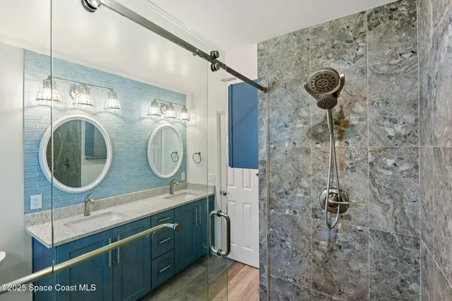 an empty room with window and ceiling fan