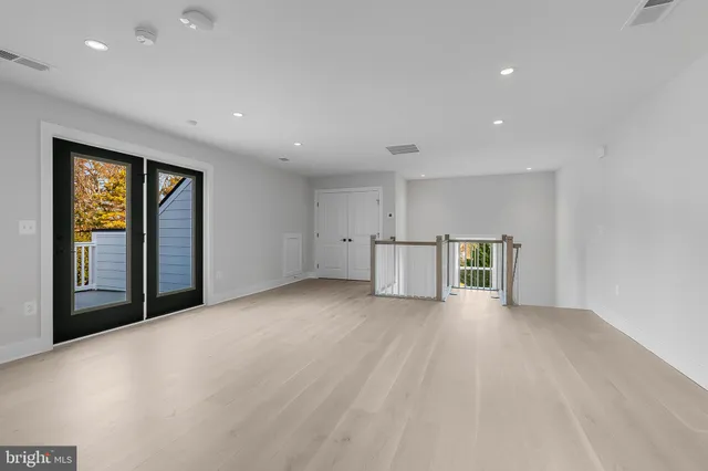 a view of a balcony with wooden fence and floor