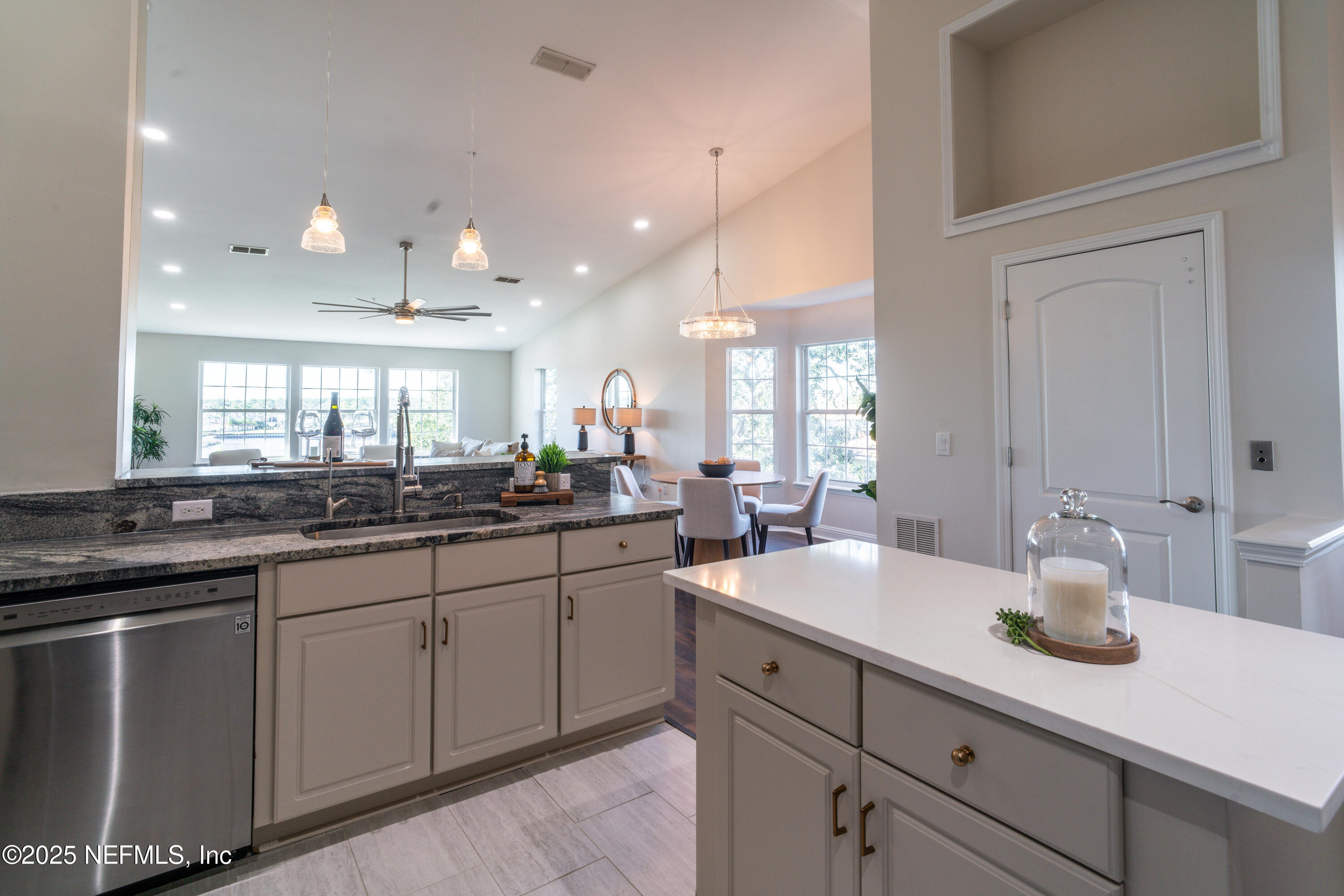 3360 Lighthouse Point Lane Jacksonville, FL 32250 - Photo 11 of 65 a large kitchen with kitchen island a sink stainless steel appliances and cabinets