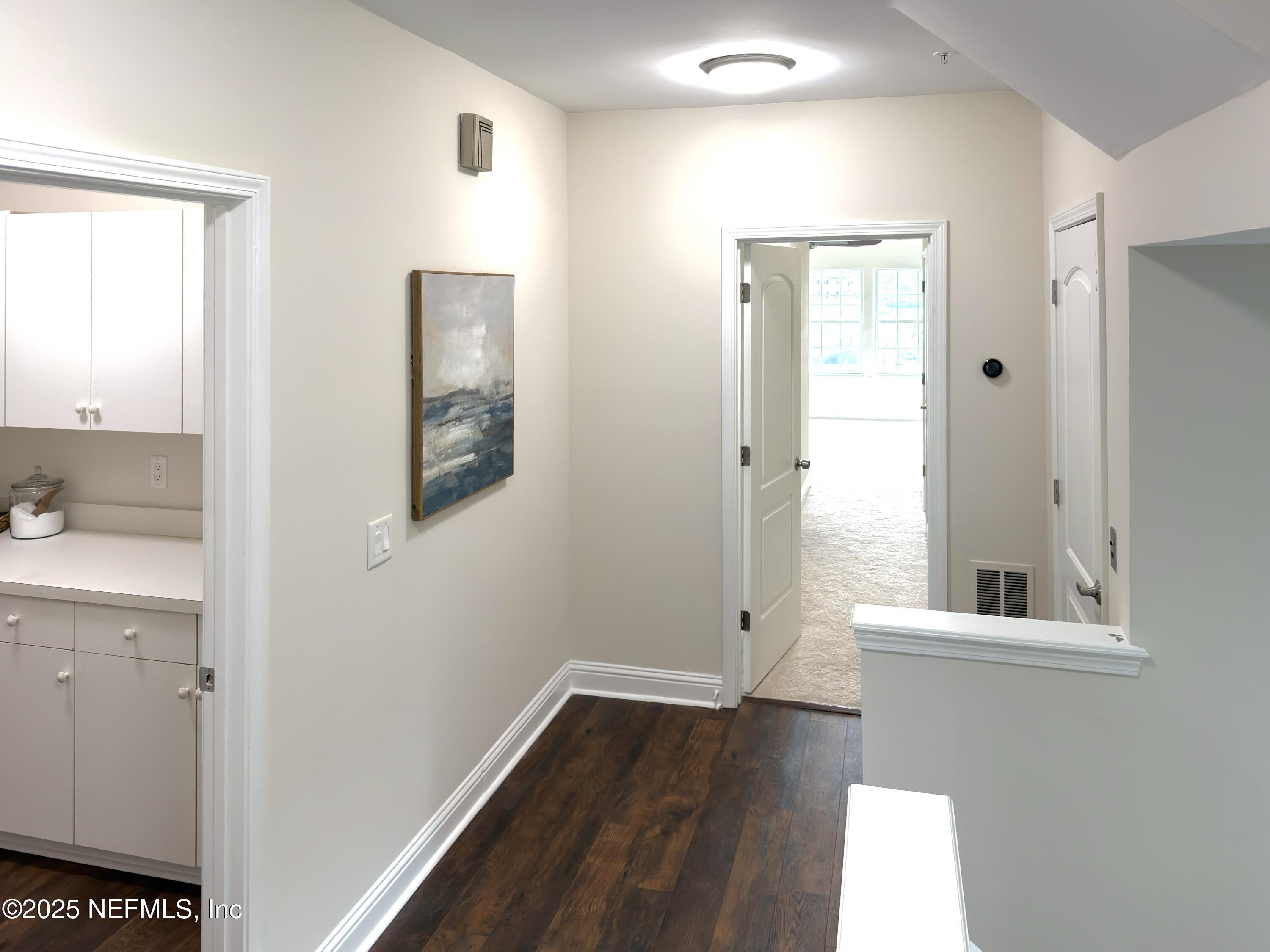 3360 Lighthouse Point Lane Jacksonville, FL 32250 - Photo 18 of 65 a view of empty room with wooden floor and fan