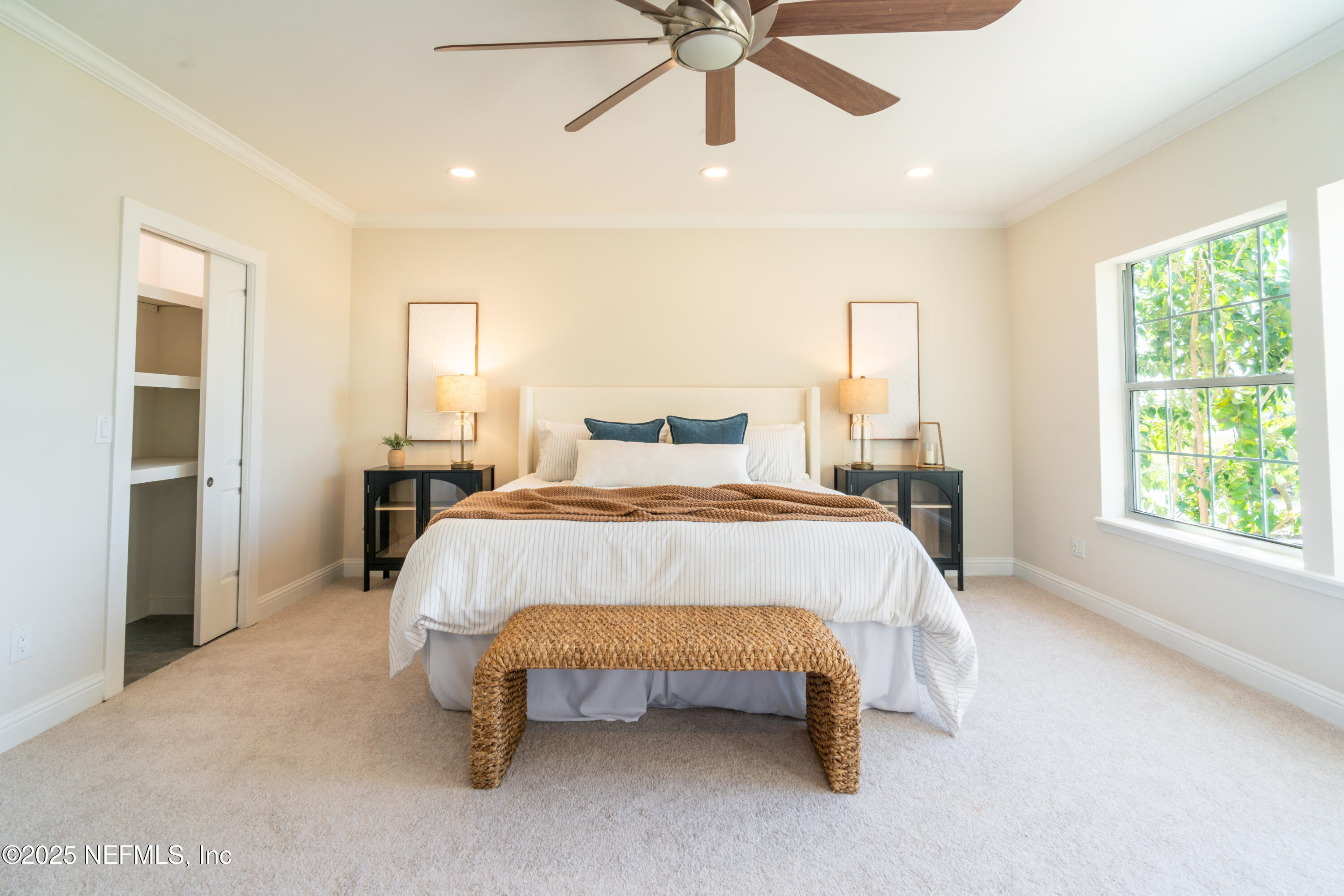 3360 Lighthouse Point Lane Jacksonville, FL 32250 - Photo 22 of 65 a bed sitting in a spacious bedroom next to a window