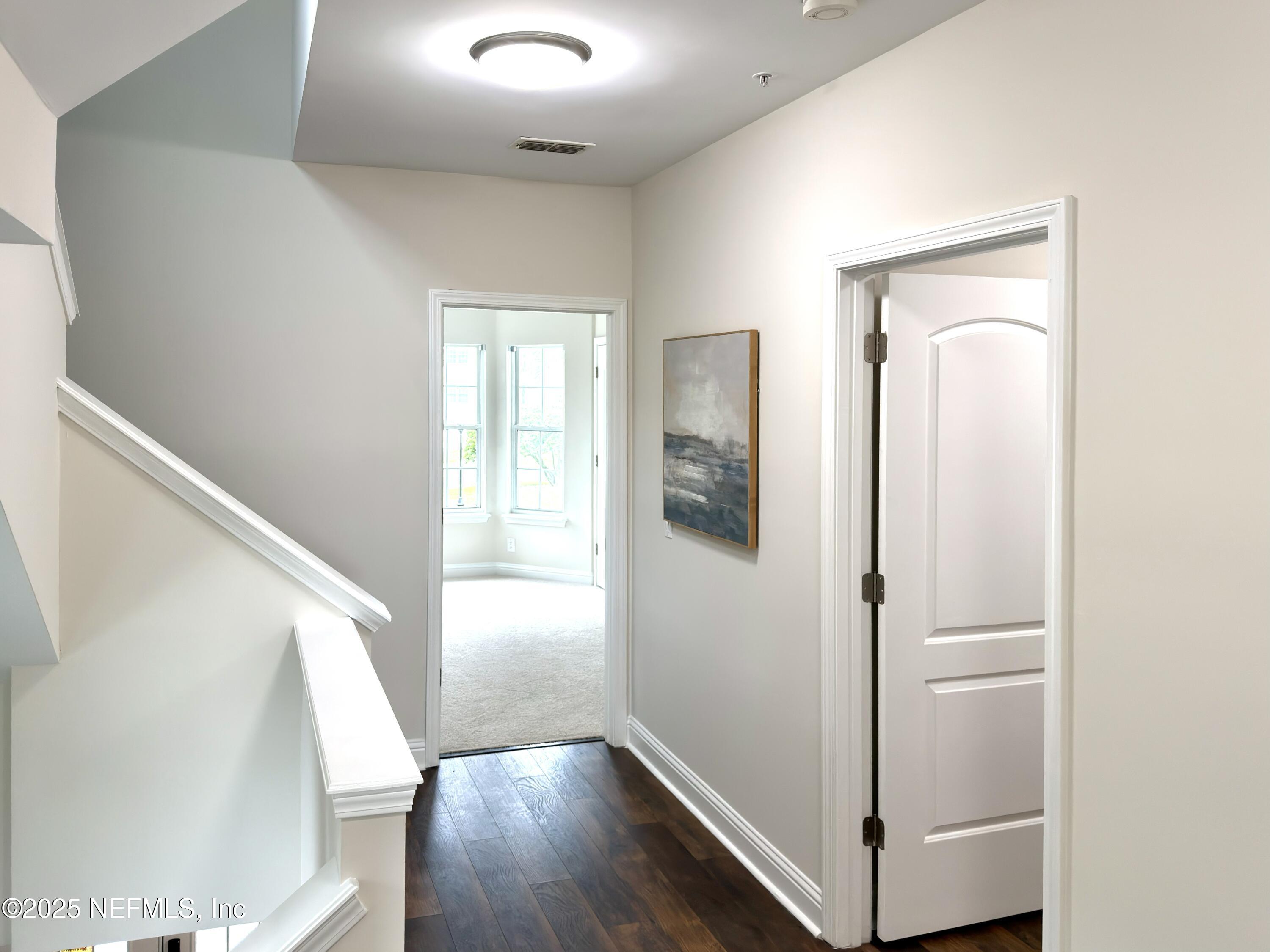 3360 Lighthouse Point Lane Jacksonville, FL 32250 - Photo 29 of 65 a view of an entryway with wooden floor