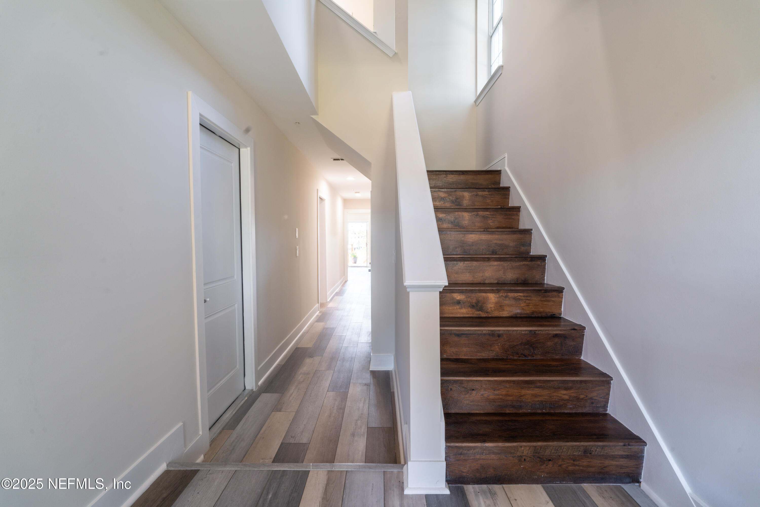 3360 Lighthouse Point Lane Jacksonville, FL 32250 - Photo 32 of 65 a view of entryway and gallery with wooden floor