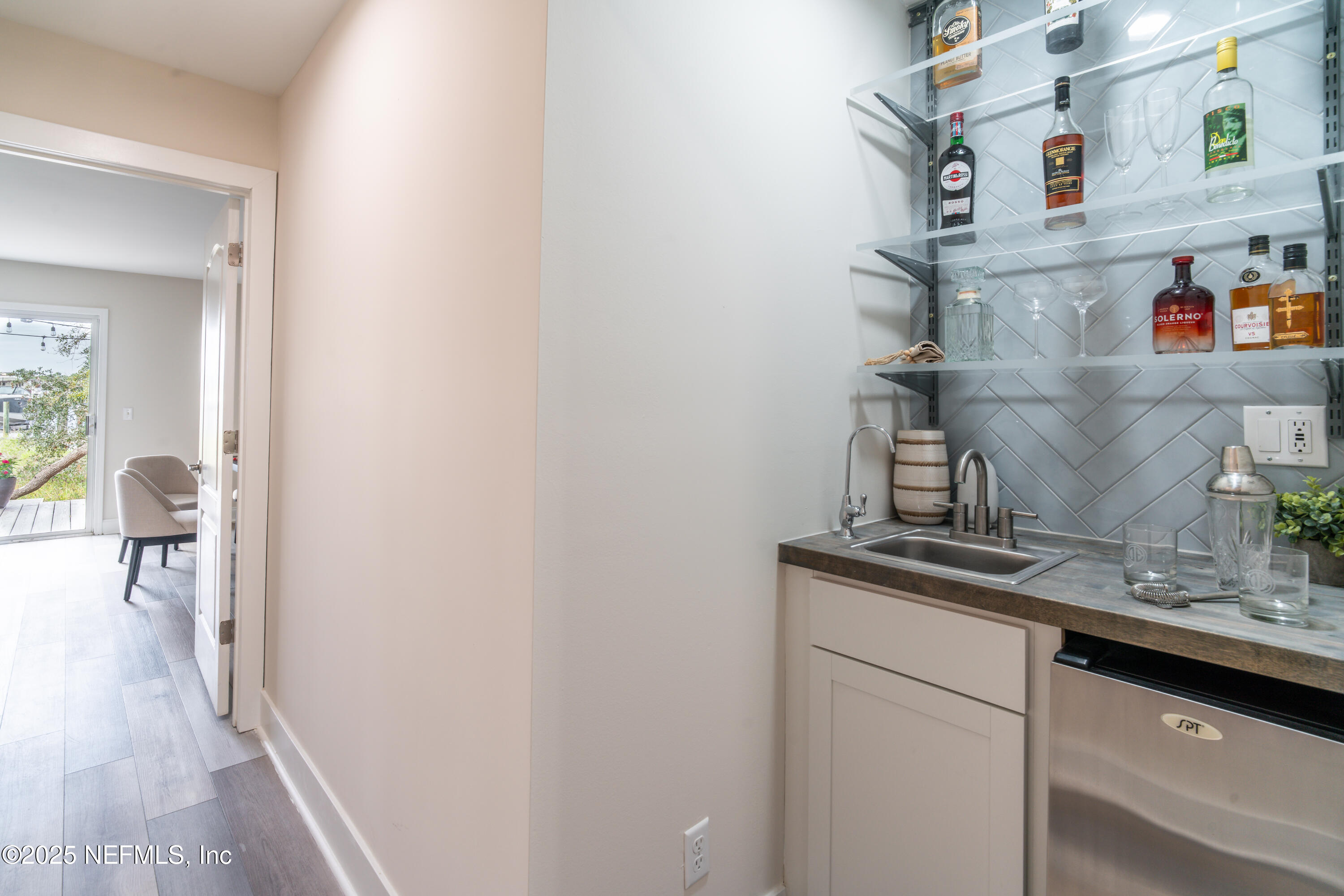 3360 Lighthouse Point Lane Jacksonville, FL 32250 - Photo 33 of 65 a view of kitchen with cabinets and wooden floor