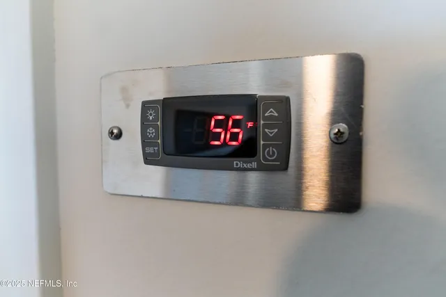 a bathroom with a bathtub a sink and a potted plant