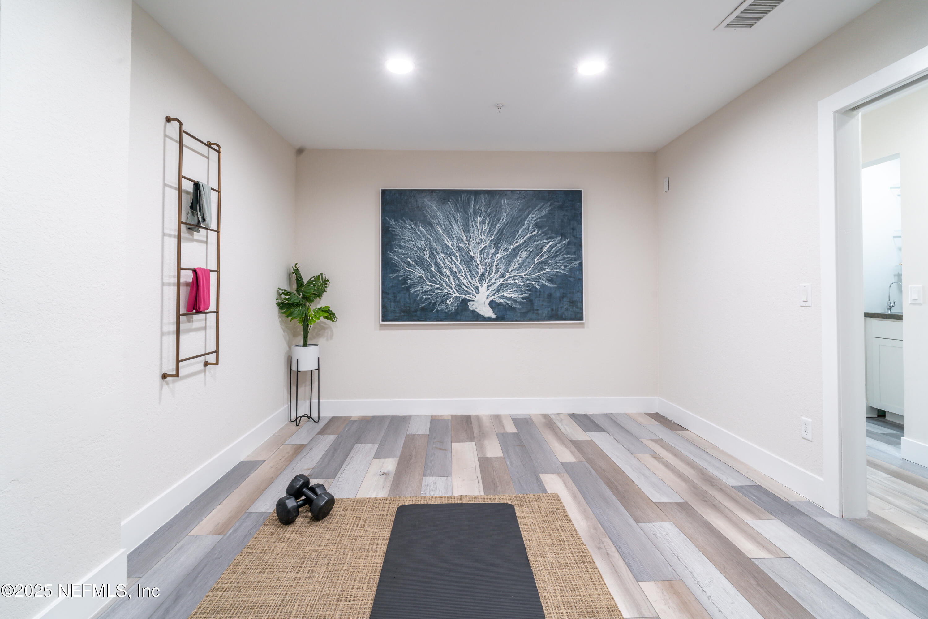 3360 Lighthouse Point Lane Jacksonville, FL 32250 - Photo 44 of 65 a room with a rug and a window