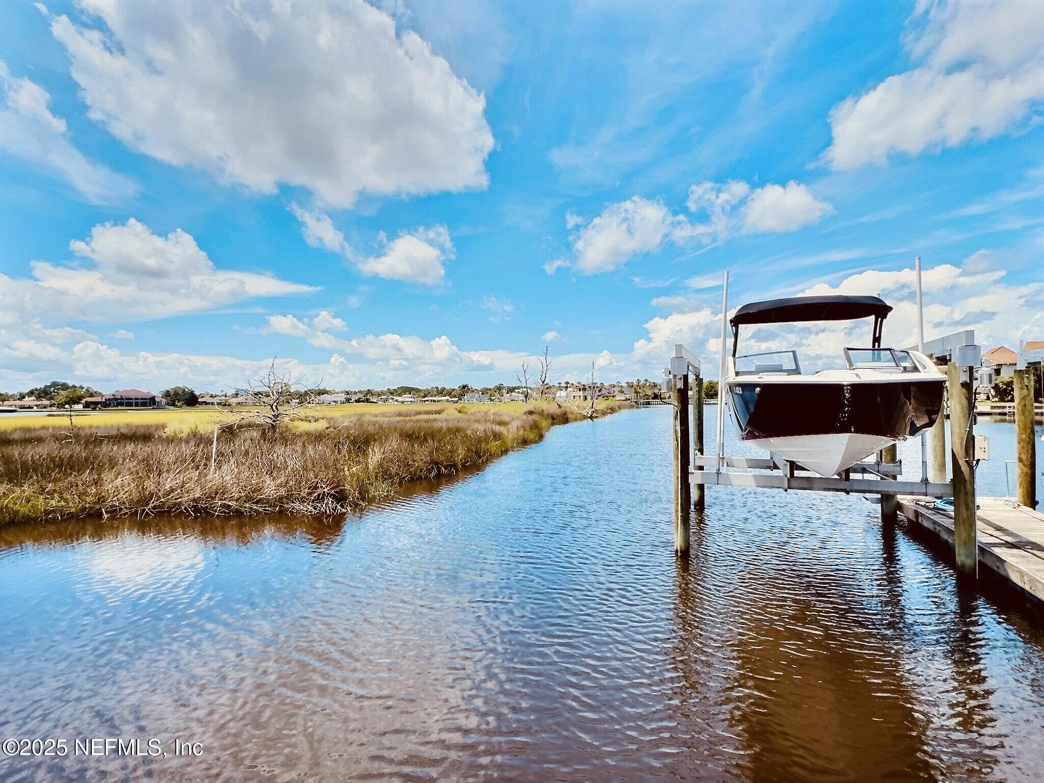 3360 Lighthouse Point Lane Jacksonville, FL 32250 - Photo 50 of 65 a view of a lake with outdoor space