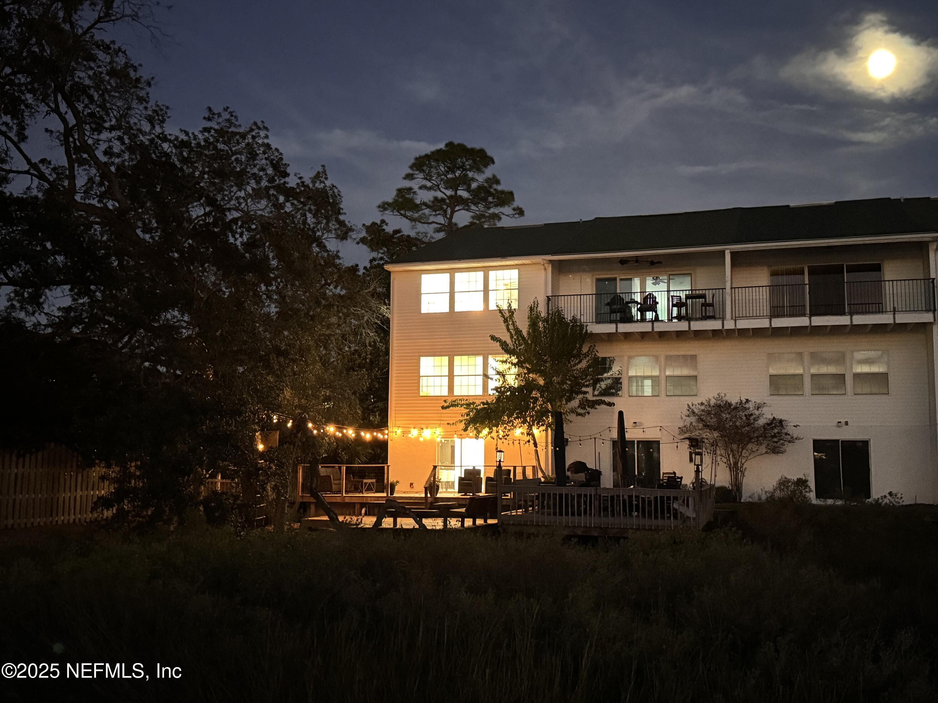 3360 Lighthouse Point Lane Jacksonville, FL 32250 - Photo 60 of 65 a front view of a house with a garden
