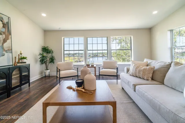 a kitchen with stainless steel appliances granite countertop a sink counter space and a stove top oven