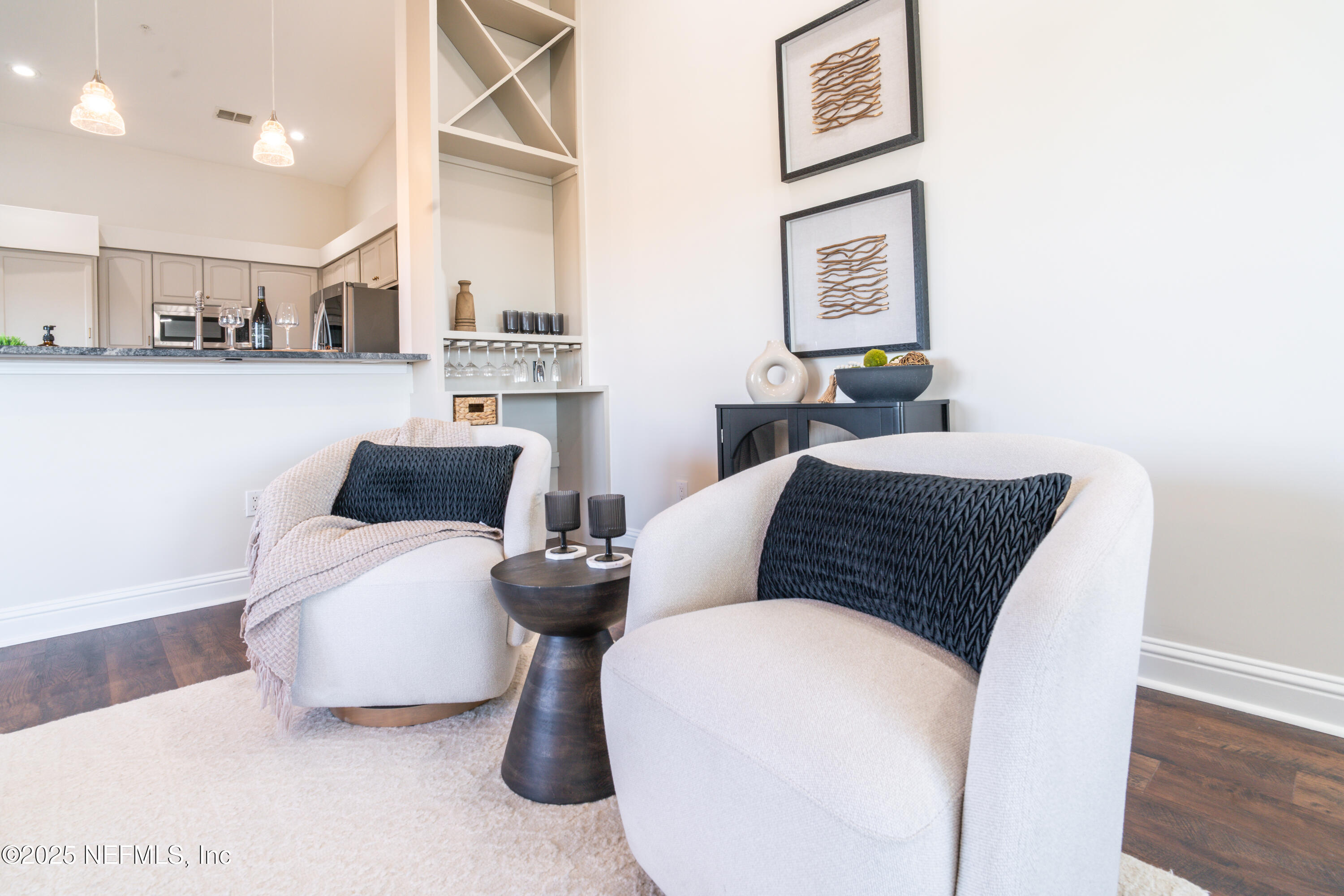 3360 Lighthouse Point Lane Jacksonville, FL 32250 - Photo 7 of 65 a living room with furniture and painting on the wall