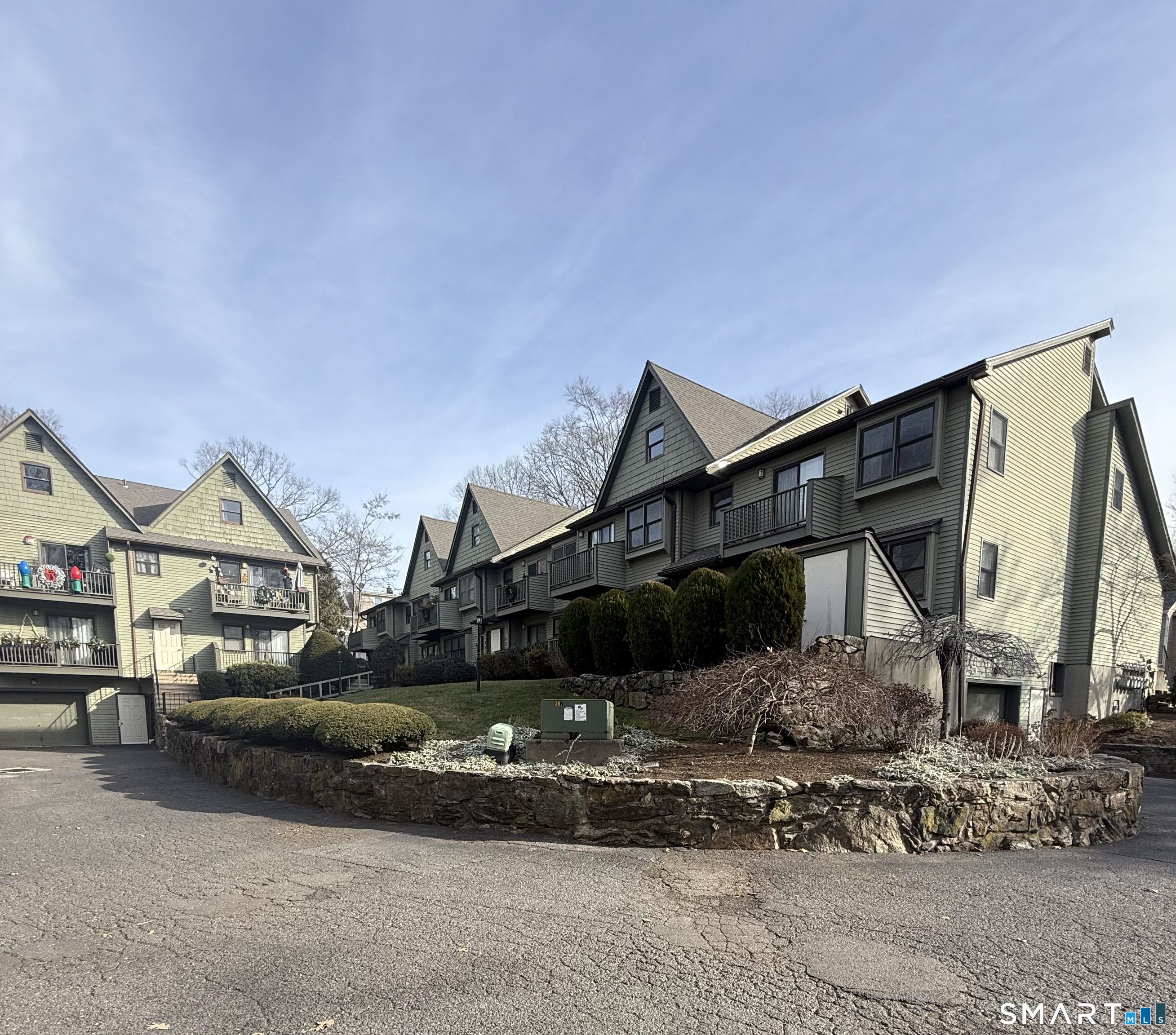 462 Glendale Avenue, Unit 20 Bridgeport, CT 06606 - Photo 2 of 13 a front view of a house with a yard