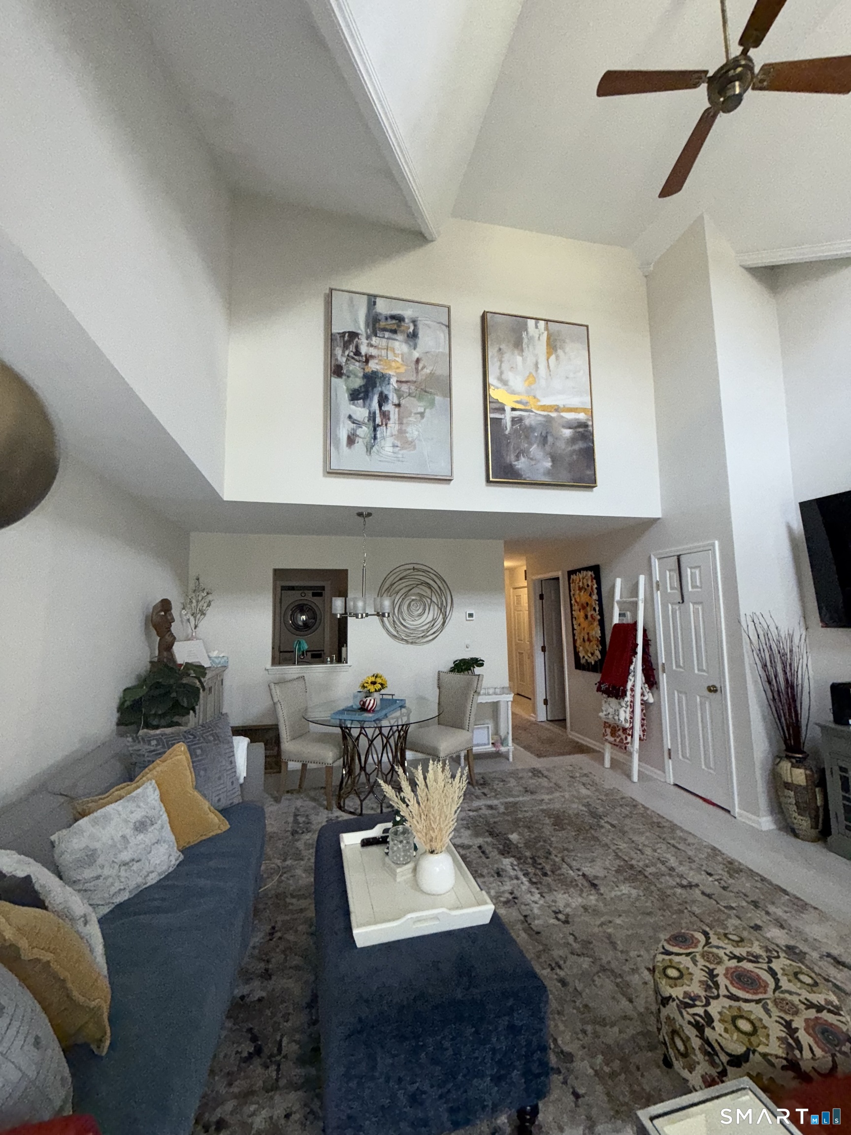 462 Glendale Avenue, Unit 20 Bridgeport, CT 06606 - Photo 4 of 13 a living room with furniture and a flat screen tv