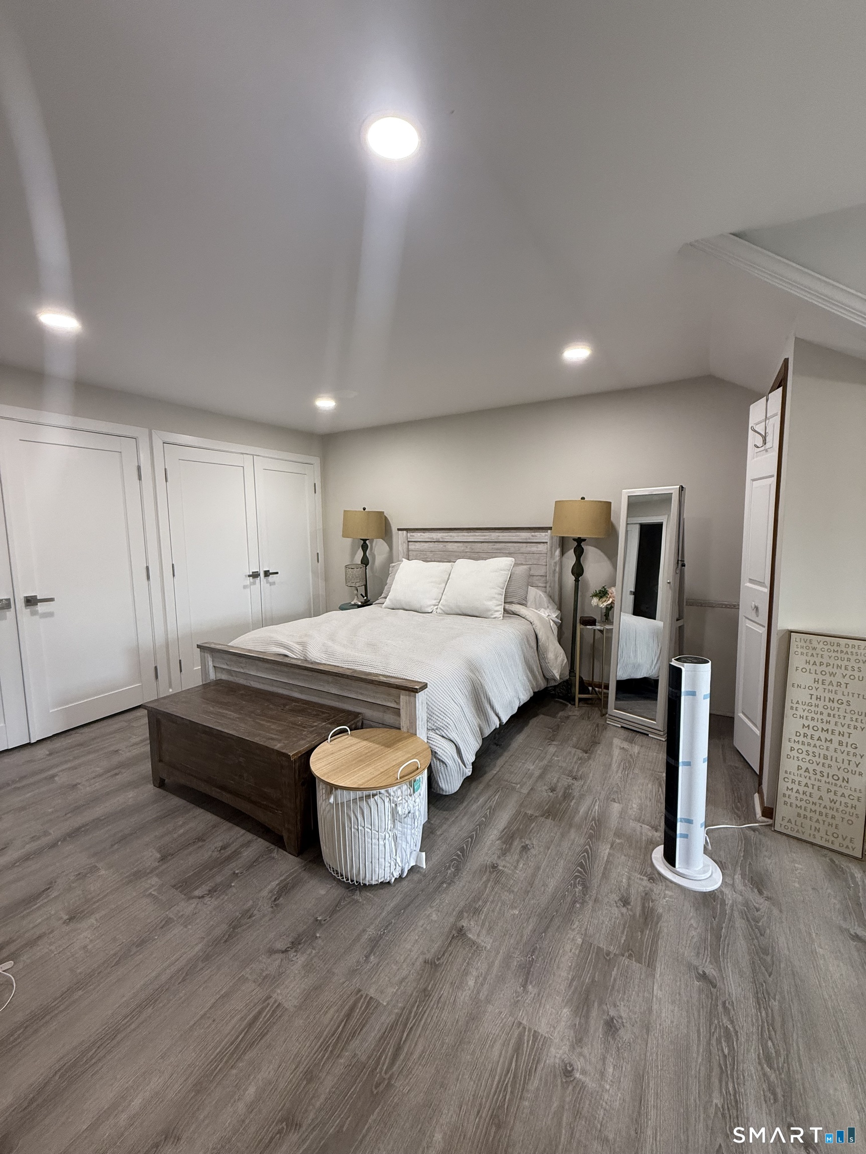 462 Glendale Avenue, Unit 20 Bridgeport, CT 06606 - Photo 9 of 13 a spacious bedroom with a bed and wooden floor