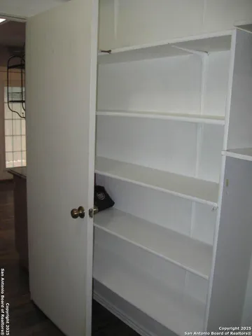 a view of a hallway with closet